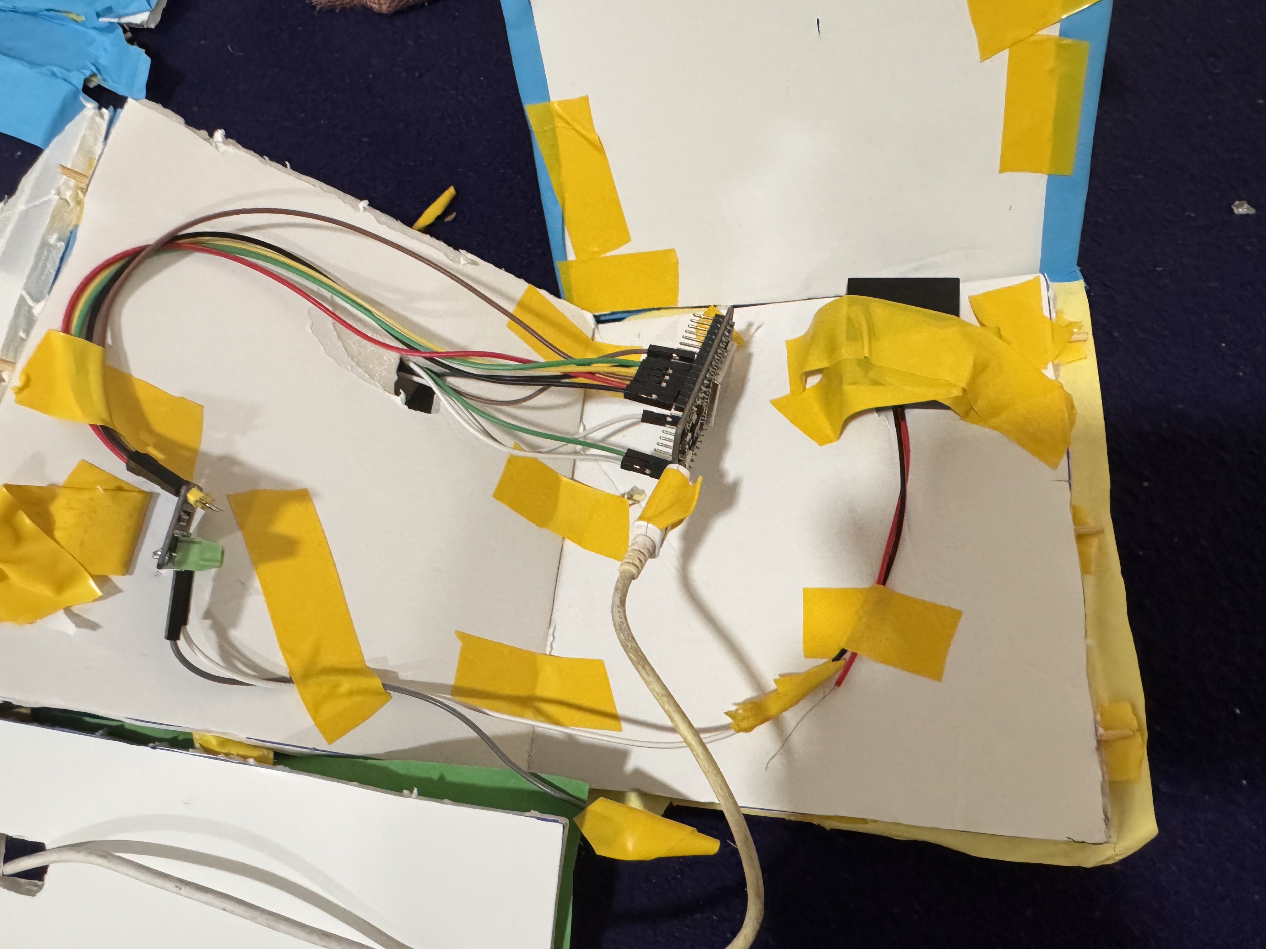 Close-up of the ESP32 development board with multicolored jumper wires